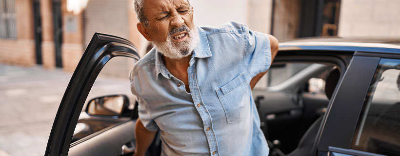 patient with back pain in need of auto accident injury care in Fort Worth